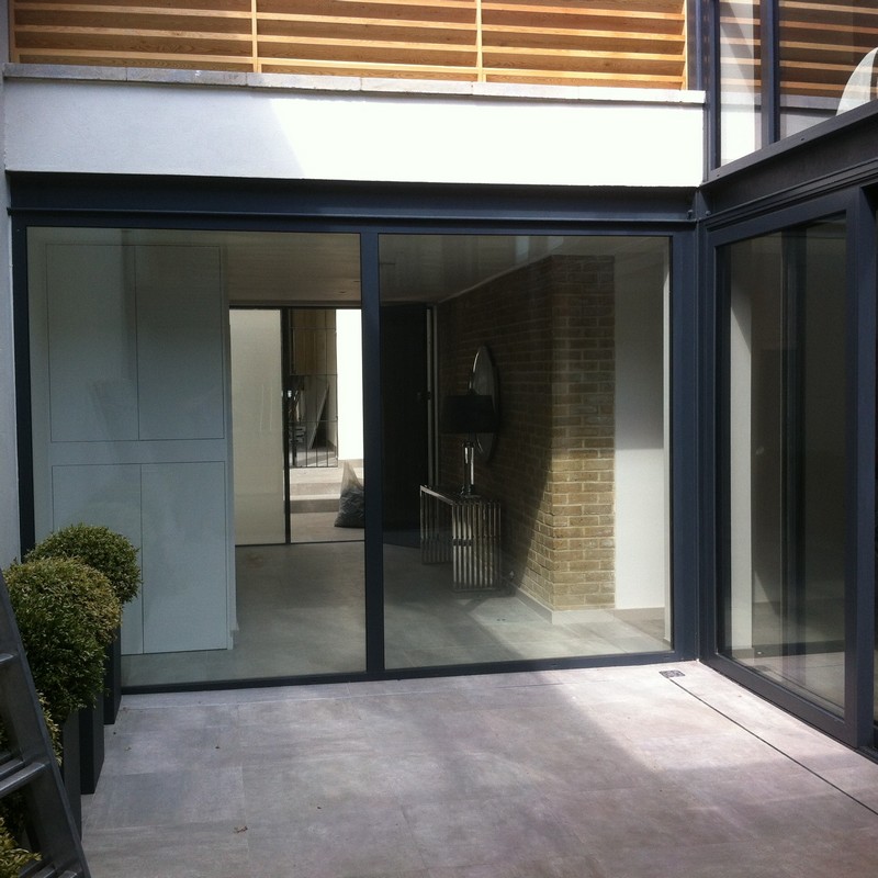 Floor-to-ceiling sliding doors opening to courtyard in Crystal Palace